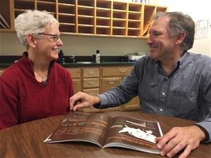 David chats with Tracy Hearing aids help David concentrate and better communicate with colleagues.