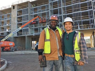 Nana Manso and Anthony Bui, on a job site.