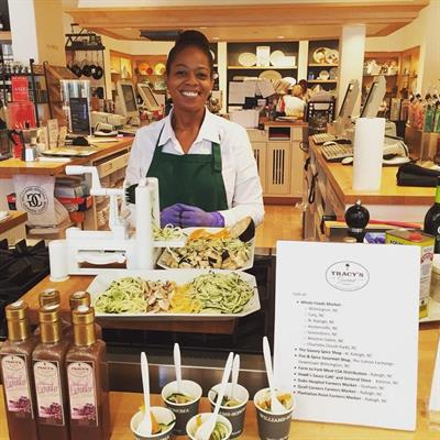 Tracy Scott from Tracy's Gourmet Tracy presenting her salad dressings