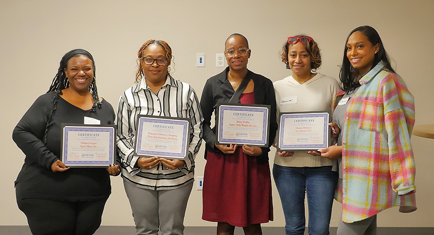 Self-Help Business Train participants gather at a meet-and-greet in Chicago.