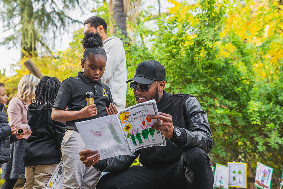 School founder Robert Golden shares a learning moment with one of GCA's students.