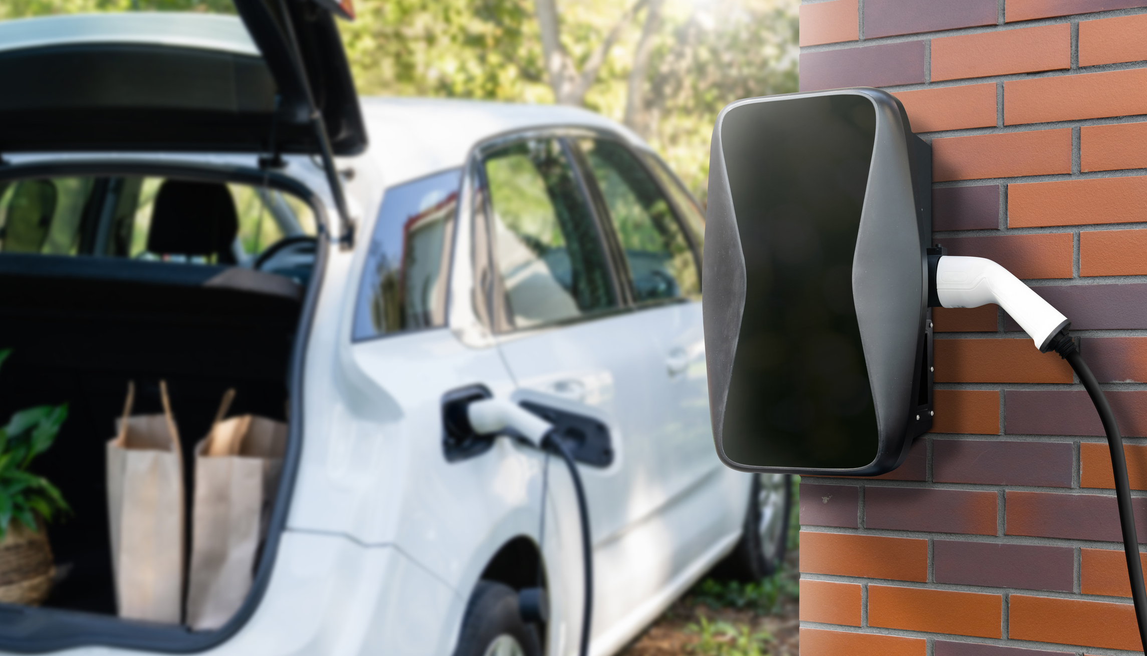 electric vehicle charger plugged into an electric vehicle