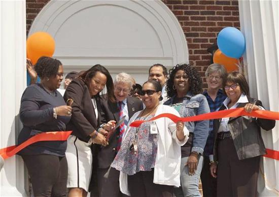 Cutting ribbon at grand opening of the ABC Center in East Durham, NC