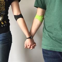 Blood donors holding hands