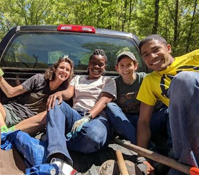 Self-Help staffers volunteer for Community Urban AgriNomics on Earth Day.