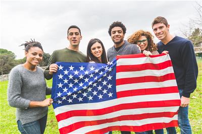 Group holding American Flag