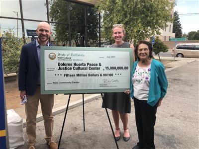 IMG_5956 Tim, Lily and Dolores Huerta with facsimile of a check from the state for the new Cultural Center