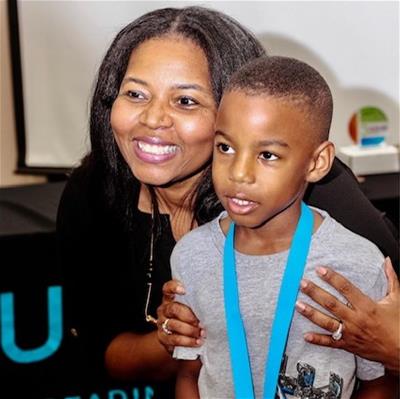Kumon-5-square Educator Toiya Hancock with a student