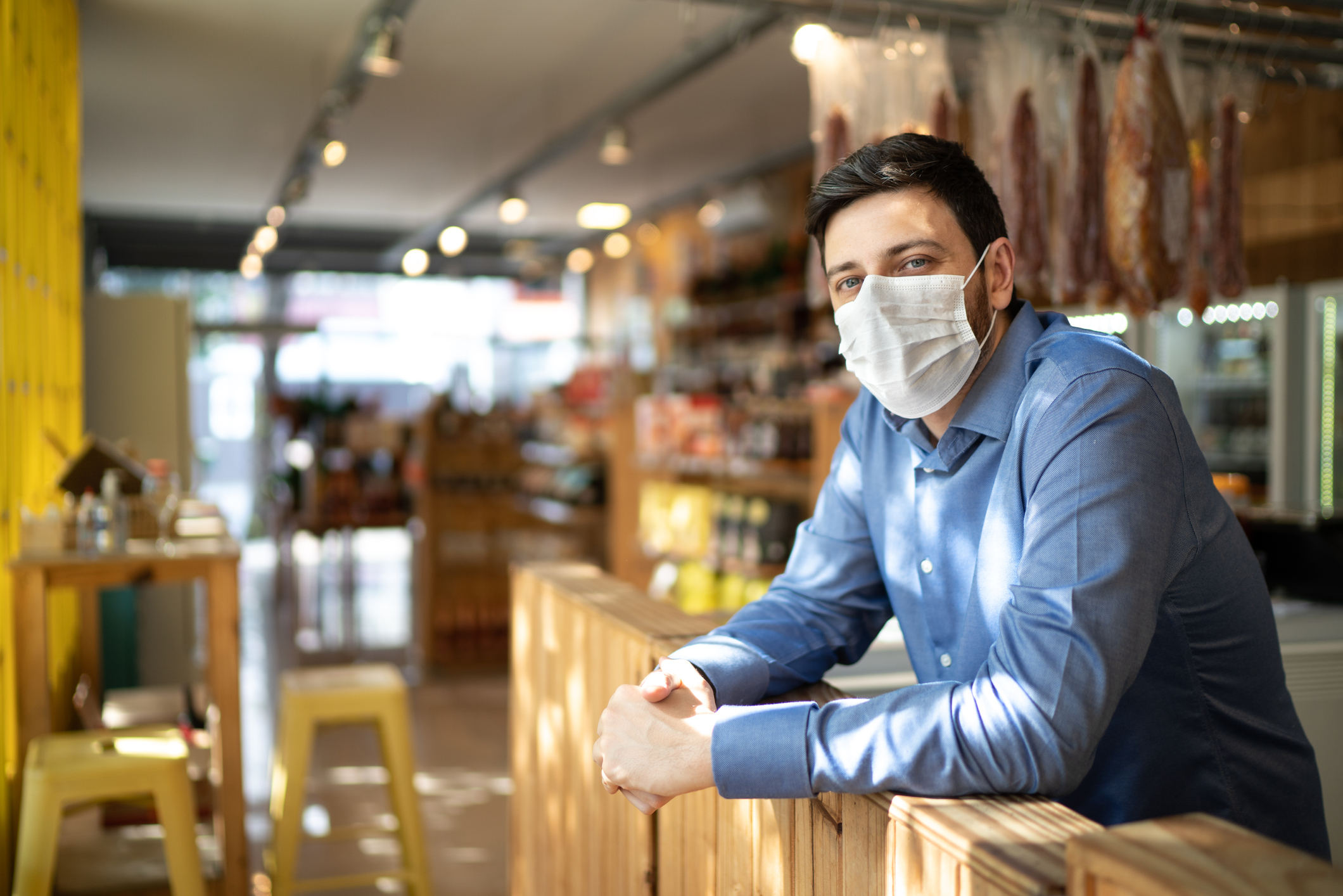 Small business owner in COVID mask