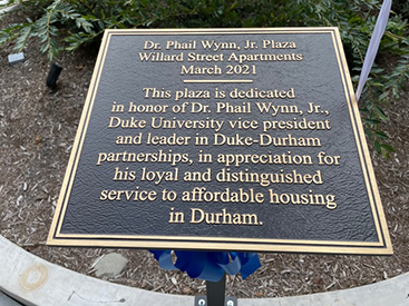 Plaque dedicating Willard Street Apartments Plaza to Dr. Phail Wynn
